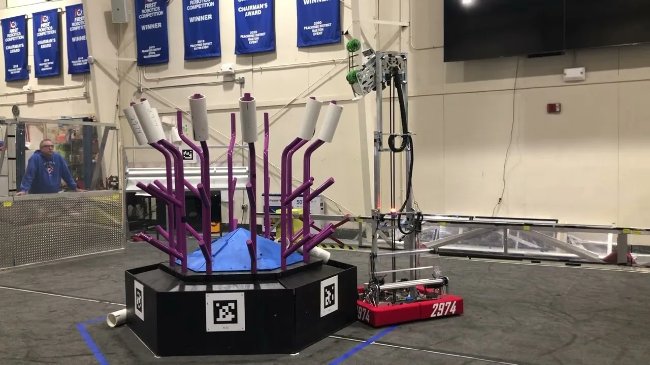 Robot 2974 scoring on a practice reef